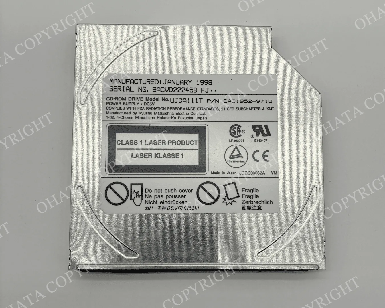 Older slim CD-ROM drive with manufacturer identification label (front)