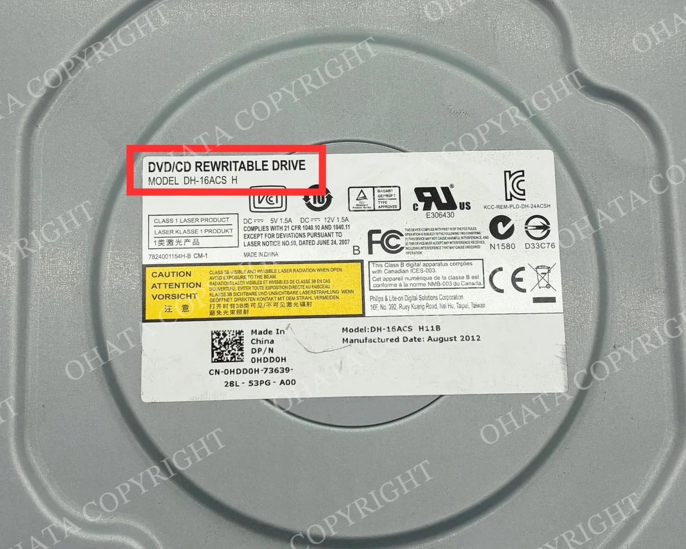DVD/CD rewritable drive identification label showing model and optical drive information