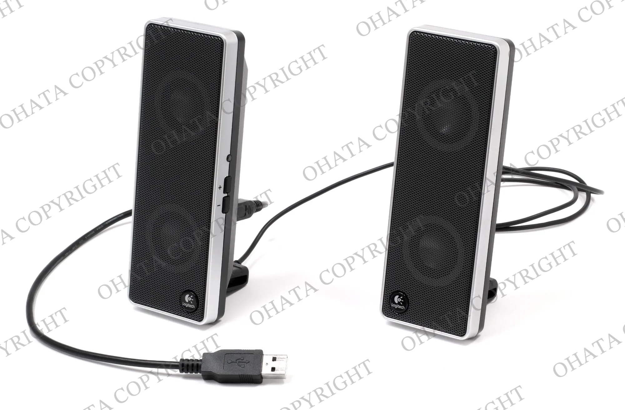Pair of black Logitech USB computer speakers with attached cables.