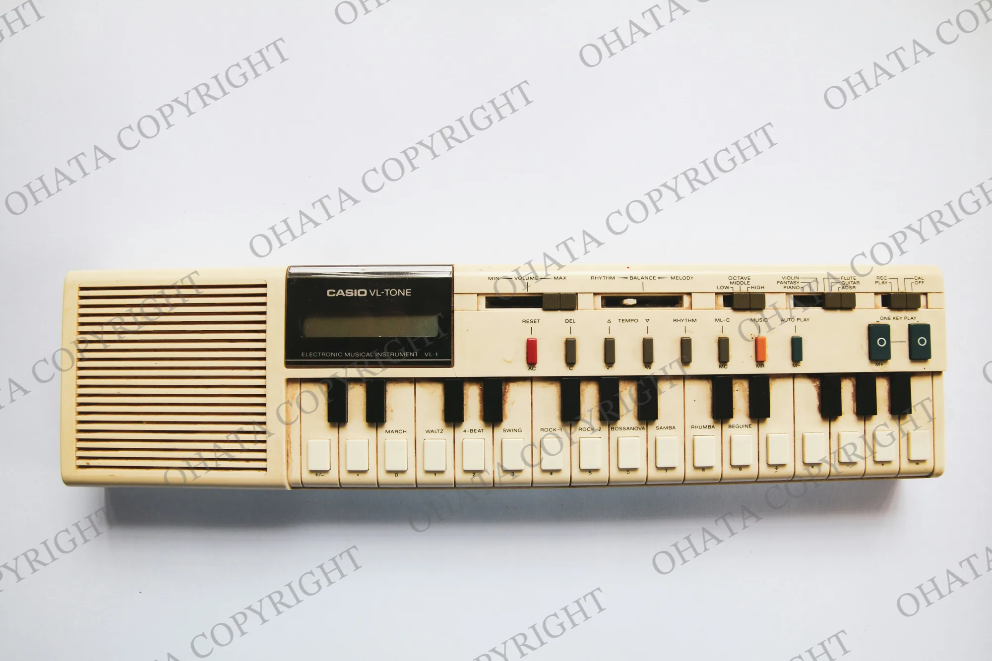 Cream-coloured Casio VL-Tone electronic keyboard with miniature keys, a built-in speaker and control switches.