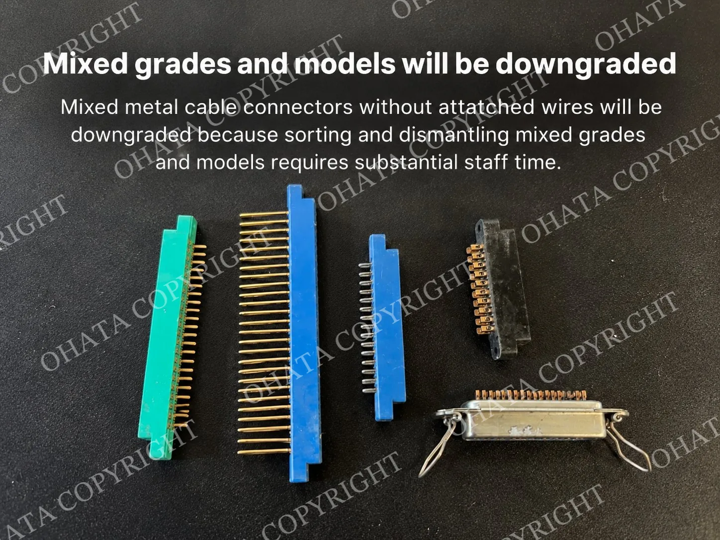 Assorted green, blue, black, and metal connectors arranged on a dark tabletop, showing different housing materials, pin layouts, sizes, and constructions.
