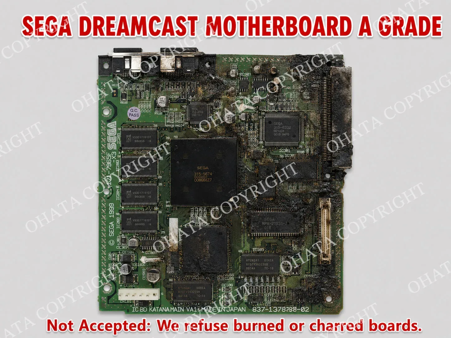Sega Dreamcast motherboard with extensive dark burn damage and charring across the circuit board.