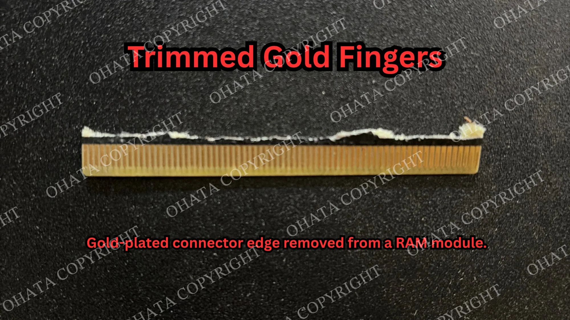 Gold-plated connector edge cut from a RAM module, showing the trimmed PCB material attached above the contacts.