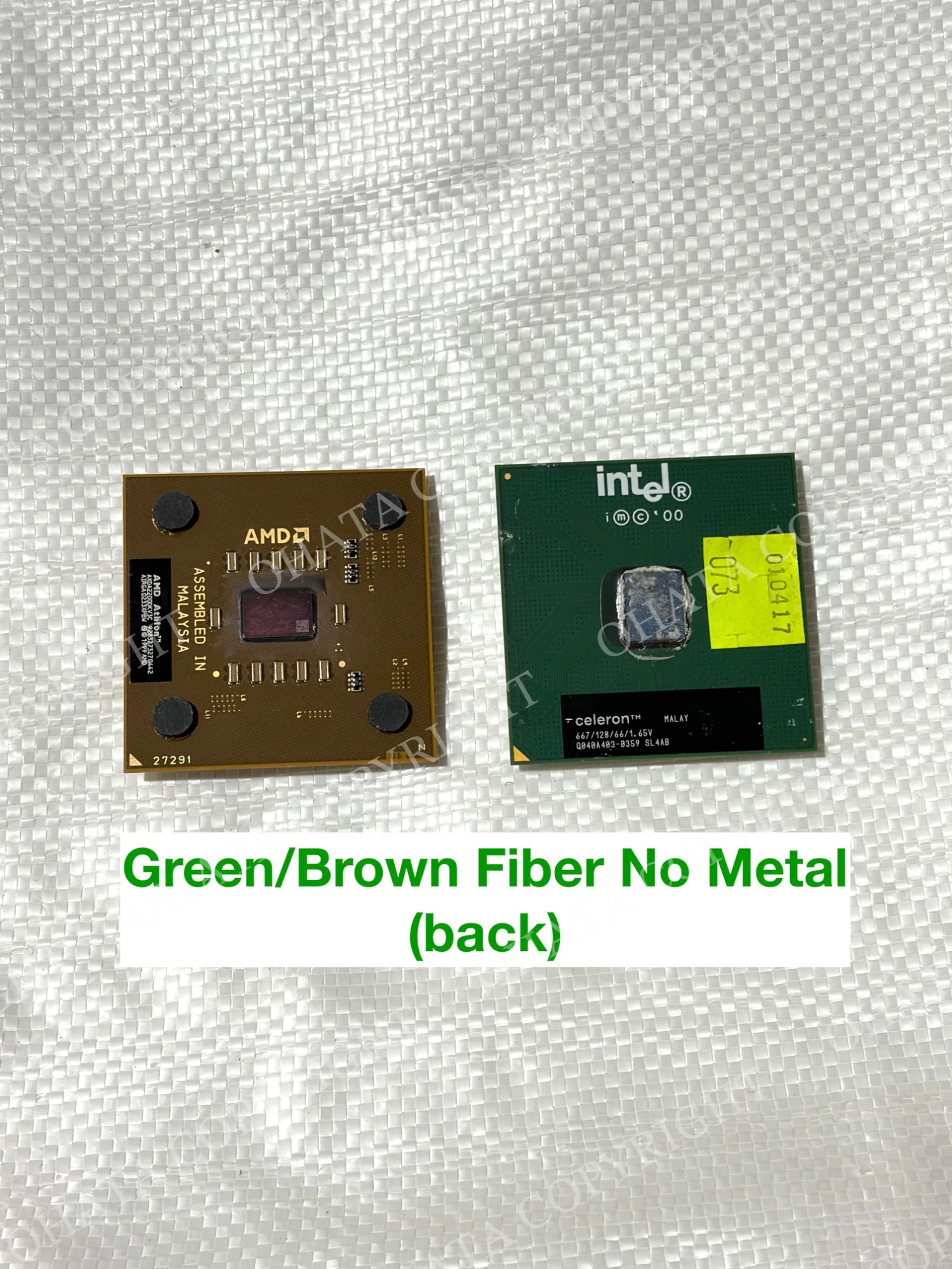 Brown AMD and green Intel processor packages showing exposed dies and manufacturer markings.