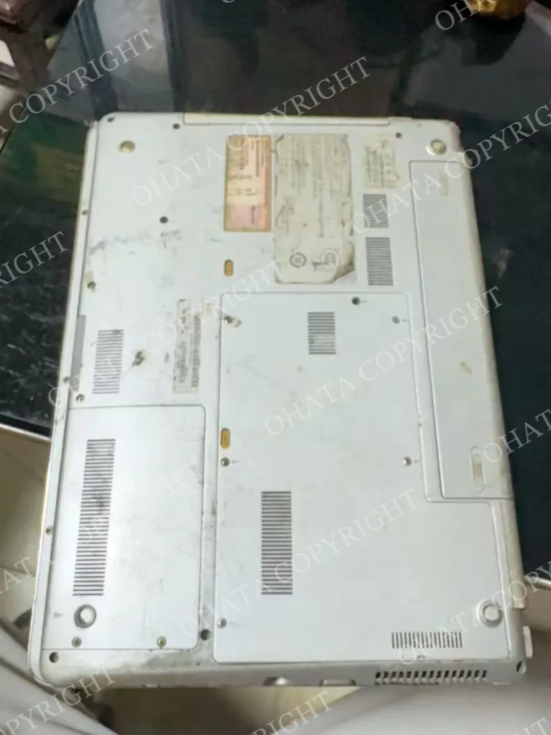 An older Sony VAIO laptop with a scuffed back cover.