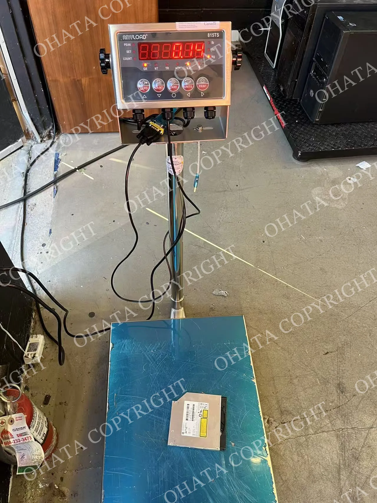 Slim computer disc drive weighing 0.14 lb at Ohata’s Richmond yard