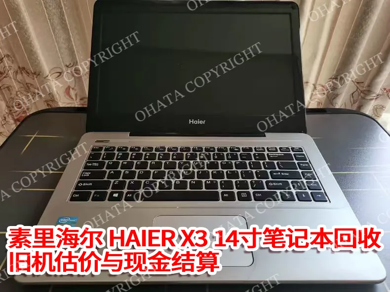 Opening the lid of the Haier X3 14 inch laptop