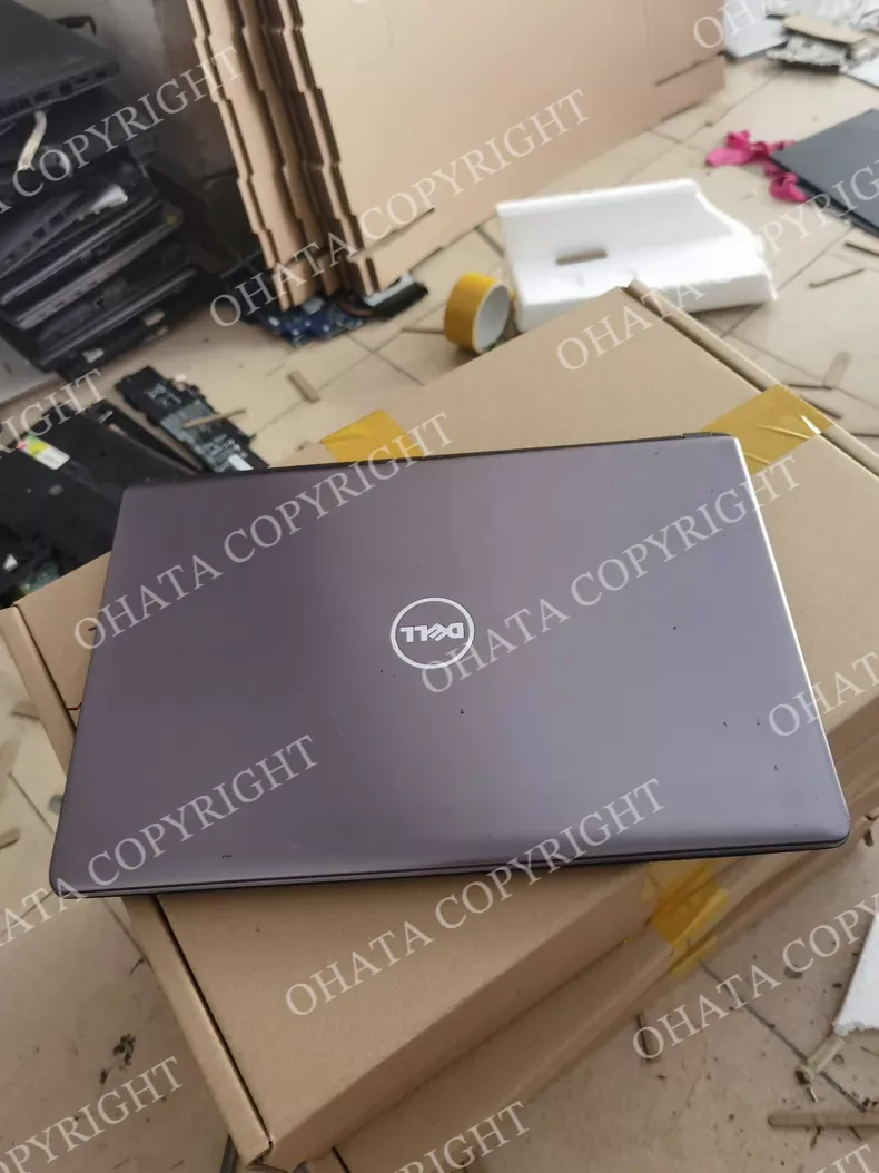 Check the top cover, hinge area, and overall appearance while the device is closed.