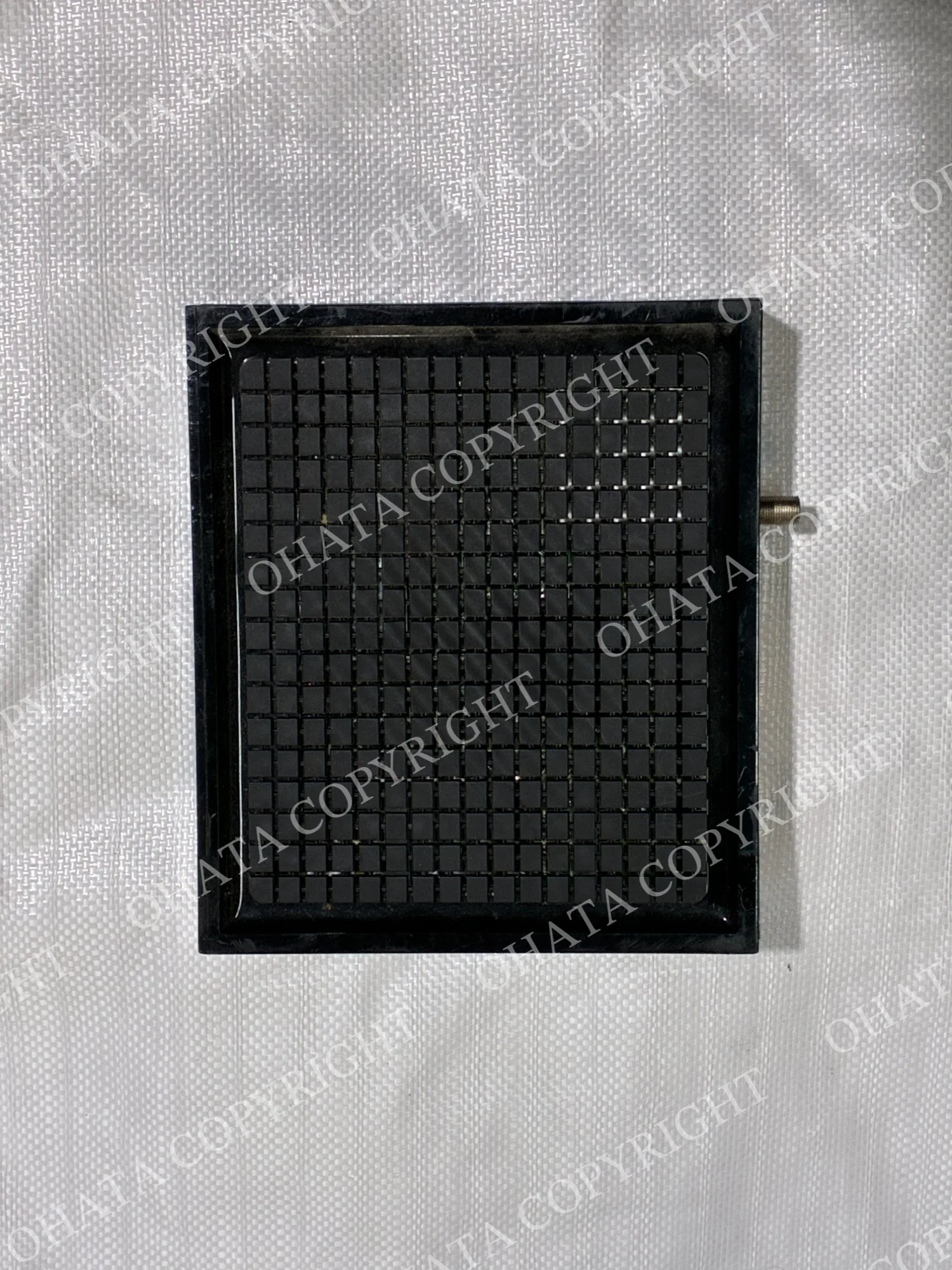 Black cable modem viewed from above with a ventilated housing and coaxial connector visible on the side.