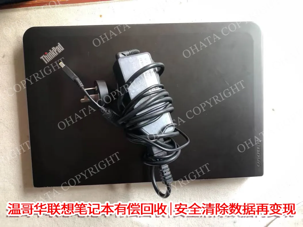 Lenovo ThinkPad Exterior with Lid Closed and Power Adapter