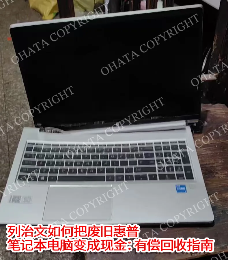 Opening the lid of an HP laptop