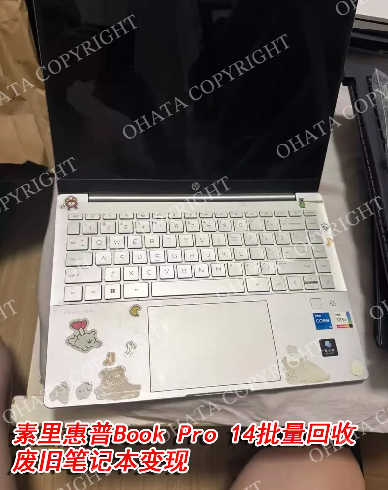 Opening the lid of the HP Book Pro 14 laptop